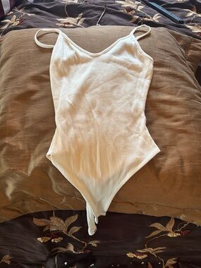 Lulu's Cream Ribbed V-Neck Snap Bodysuit